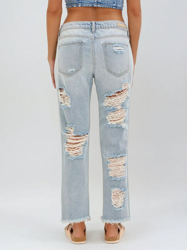 Light wash slouch Boyfriend jeans with frayed hems and distressed detailing. Bold streetwear with effortless edge.